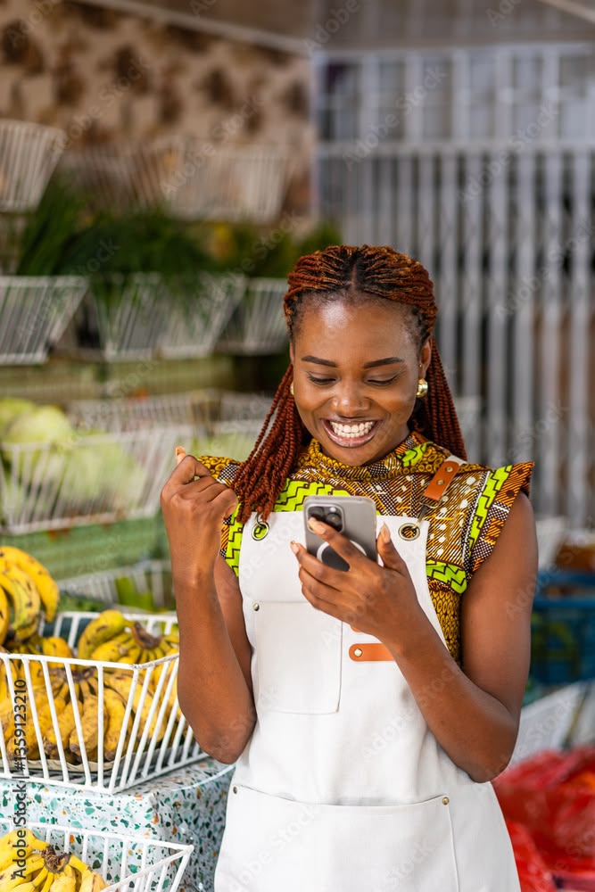 Seller managing orders on her phone